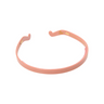 Pink thin headband on a white background.