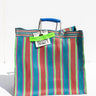 Square multicolor striped tote bag with a blue handle.
