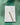 Notepad with a daily schedule and pen on a green fabric background